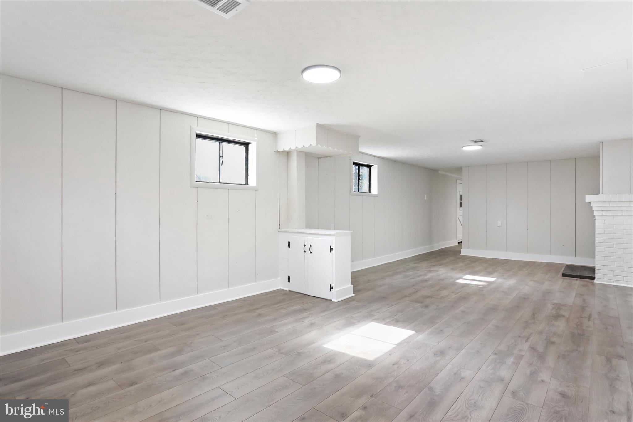 10 Linden Boulevard Middletown, MD 21769 - Photo 18 of 28 a view of a big room with wooden floor and windows