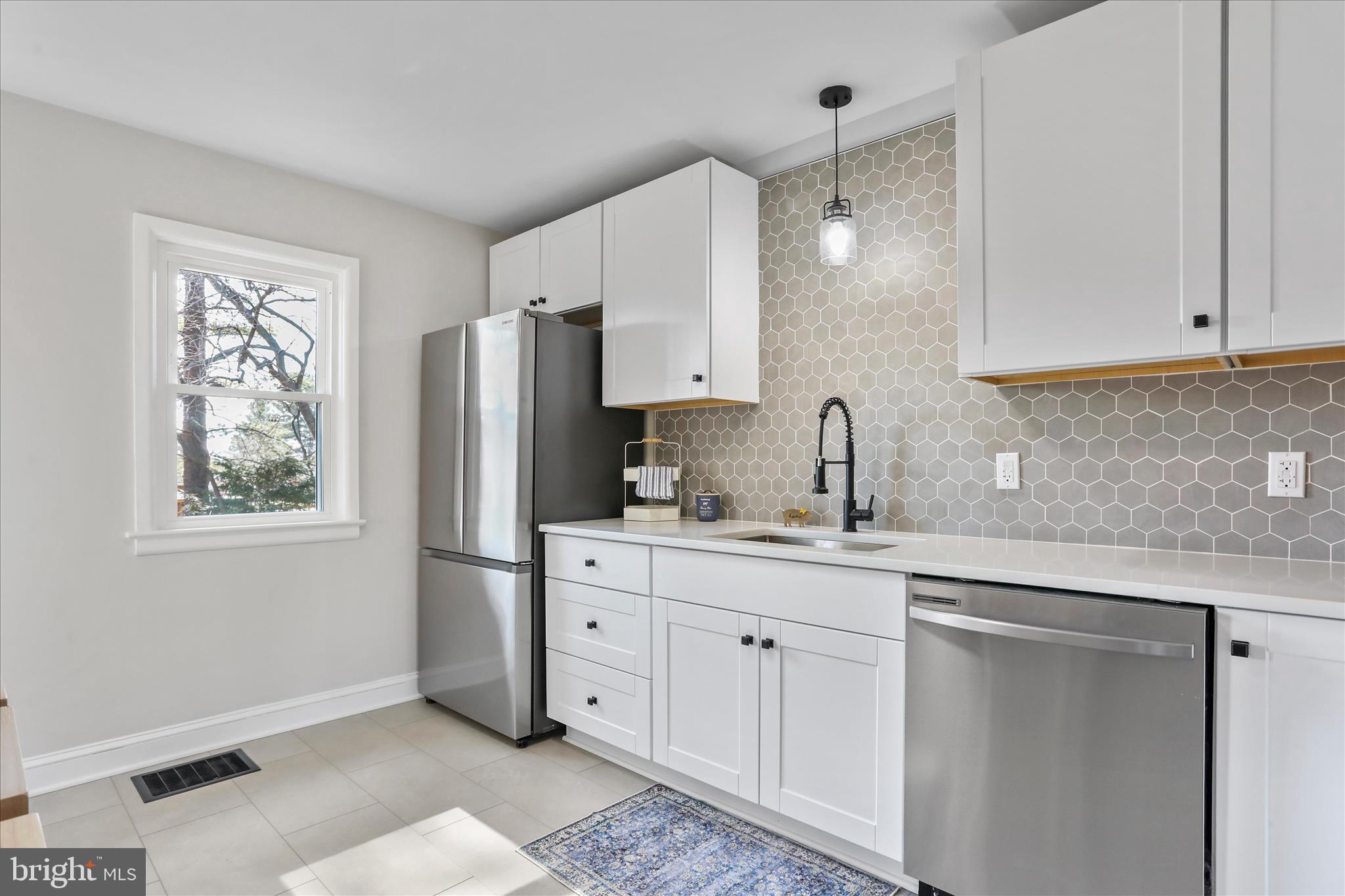 10 Linden Boulevard Middletown, MD 21769 - Photo 6 of 28 a kitchen with stainless steel appliances a sink cabinets and a window