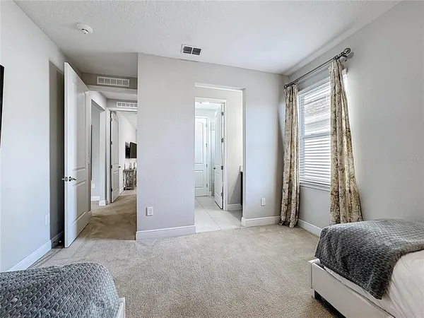 a bedroom with a bed and a television in it