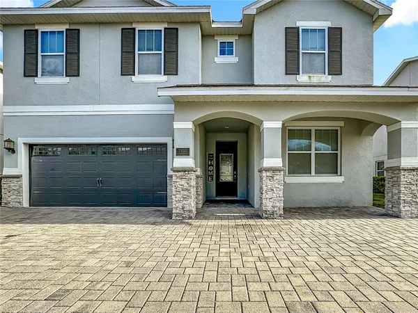 a kitchen with stainless steel appliances granite countertop a sink and a stove