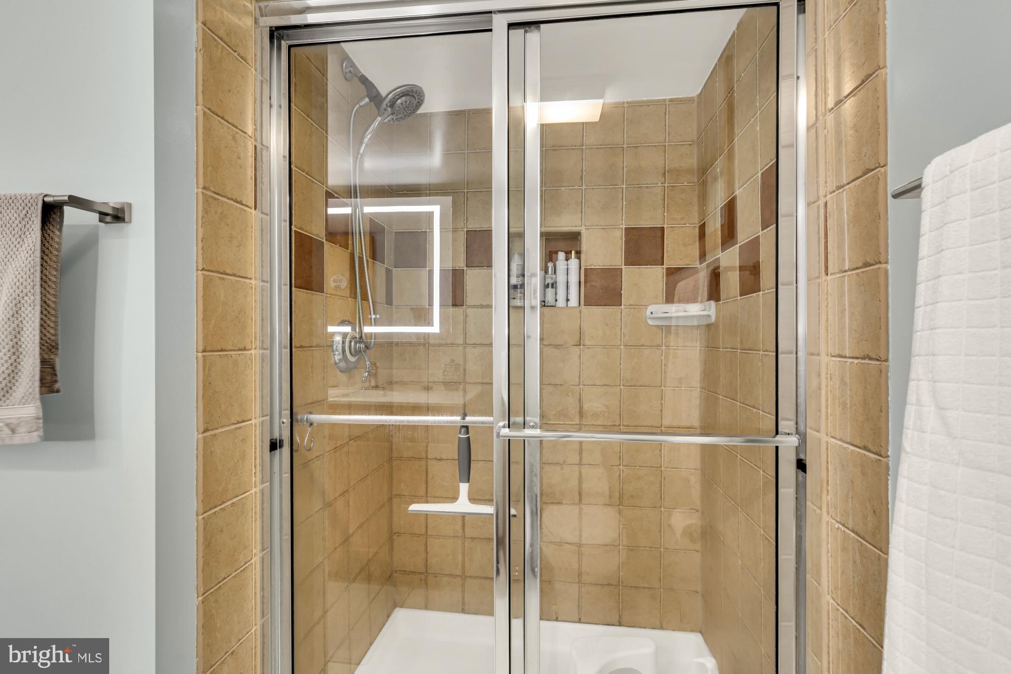 3018 Pine Spring Road Falls Church, VA 22042 - Photo 36 of 52 a bathroom with a glass shower door
