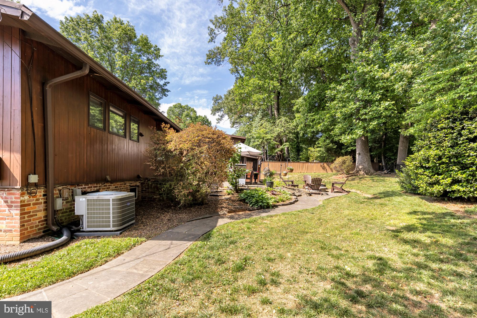 3018 Pine Spring Road Falls Church, VA 22042 - Photo 48 of 52 a view of a backyard with table and chairs potted plants and large tree