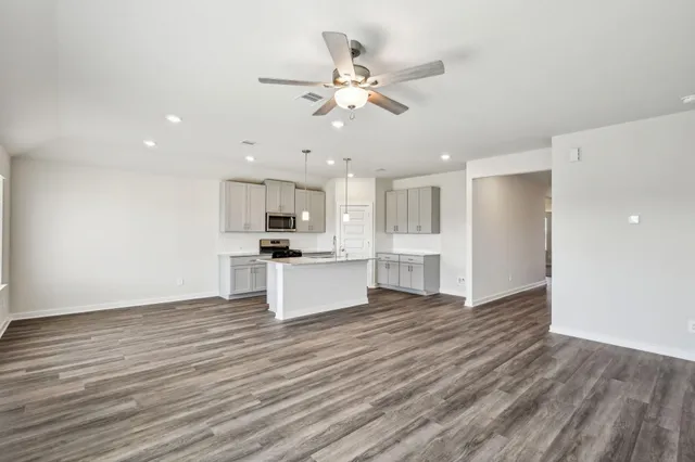 a view of kitchen with wooden floor and window