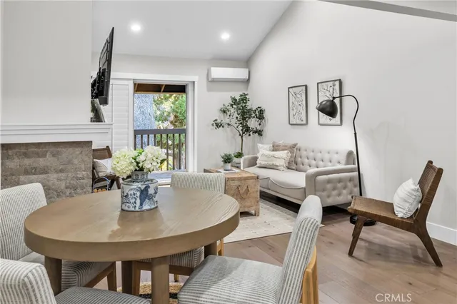 a view of a dining room with furniture and a potted plant
