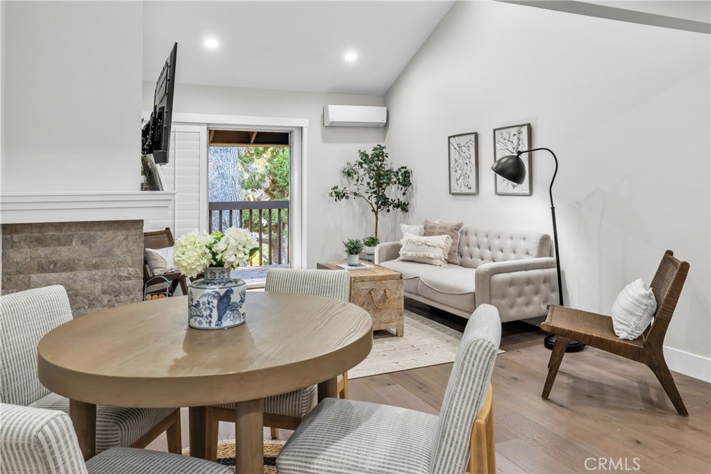 7890 East Spring Street, Unit 10F Long Beach, CA 90815 - Photo 13 of 31 a view of a dining room with furniture and a potted plant