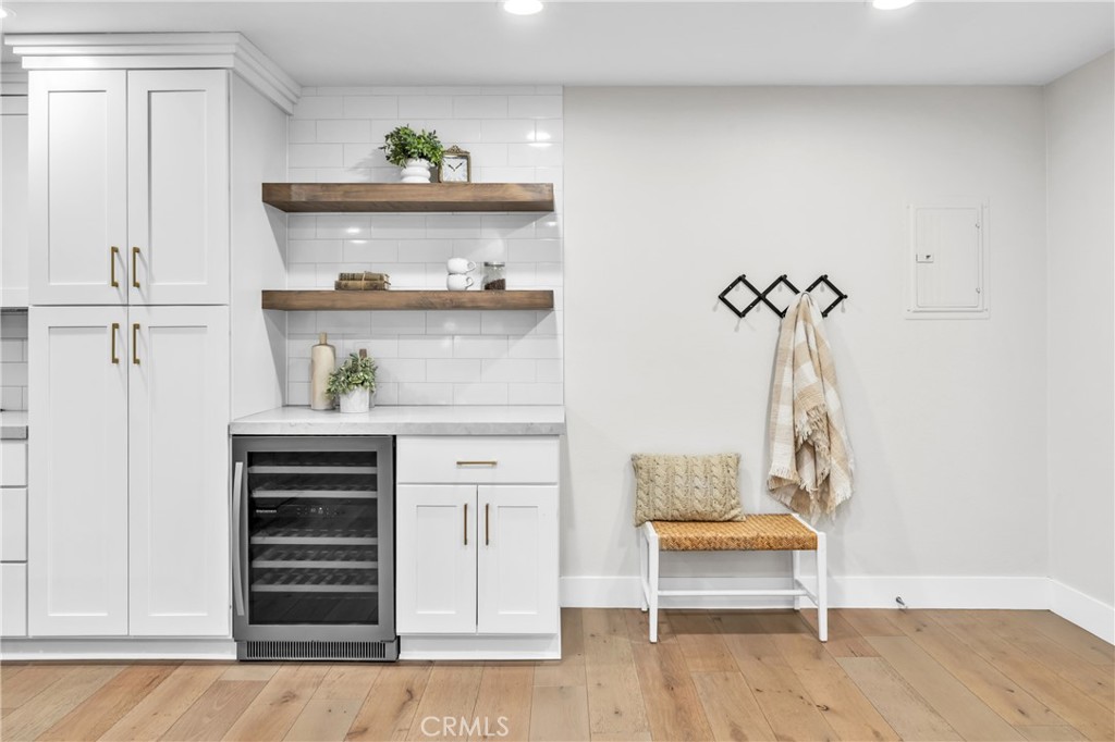 7890 East Spring Street, Unit 10F Long Beach, CA 90815 - Photo 7 of 31 a living room with furniture and wooden floor