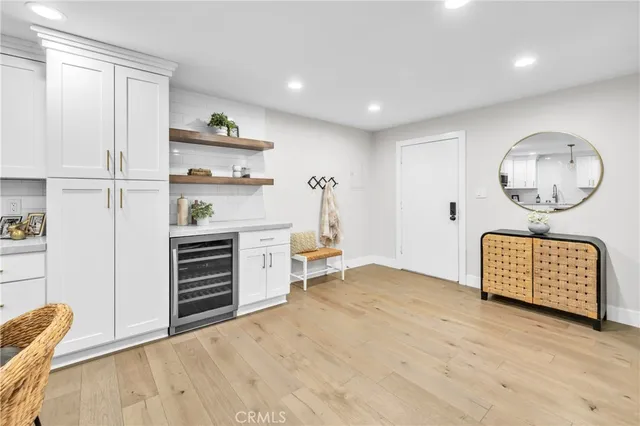 a view of kitchen with furniture and wooden floor