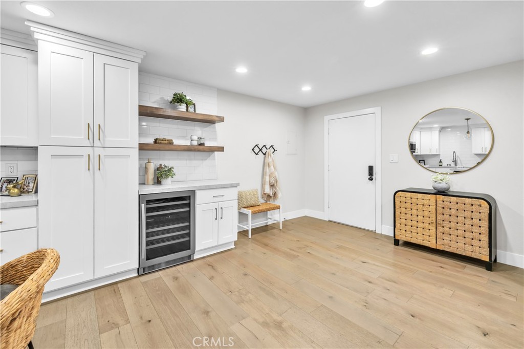 7890 East Spring Street, Unit 10F Long Beach, CA 90815 - Photo 8 of 31 a view of kitchen with furniture and wooden floor