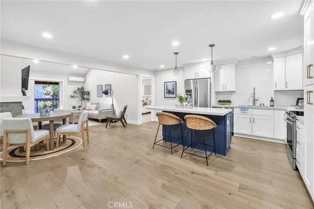 a large kitchen with a table and chairs in it