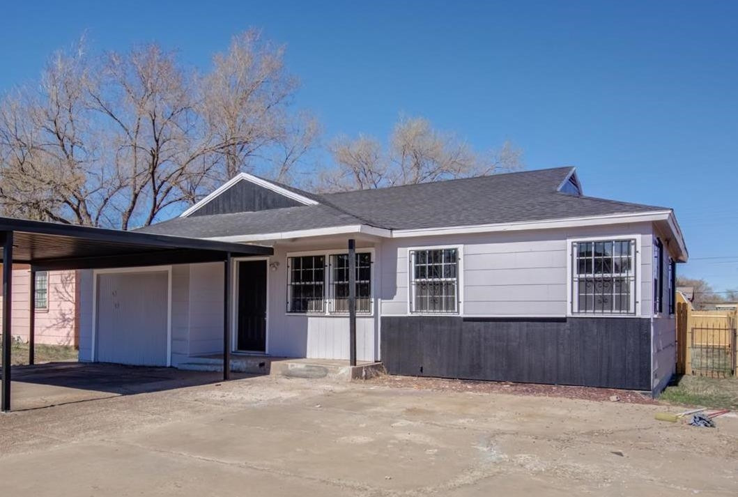 526 53rd Street Lubbock, TX 79404 - Photo 1 of 28 a front view of a house with a garage