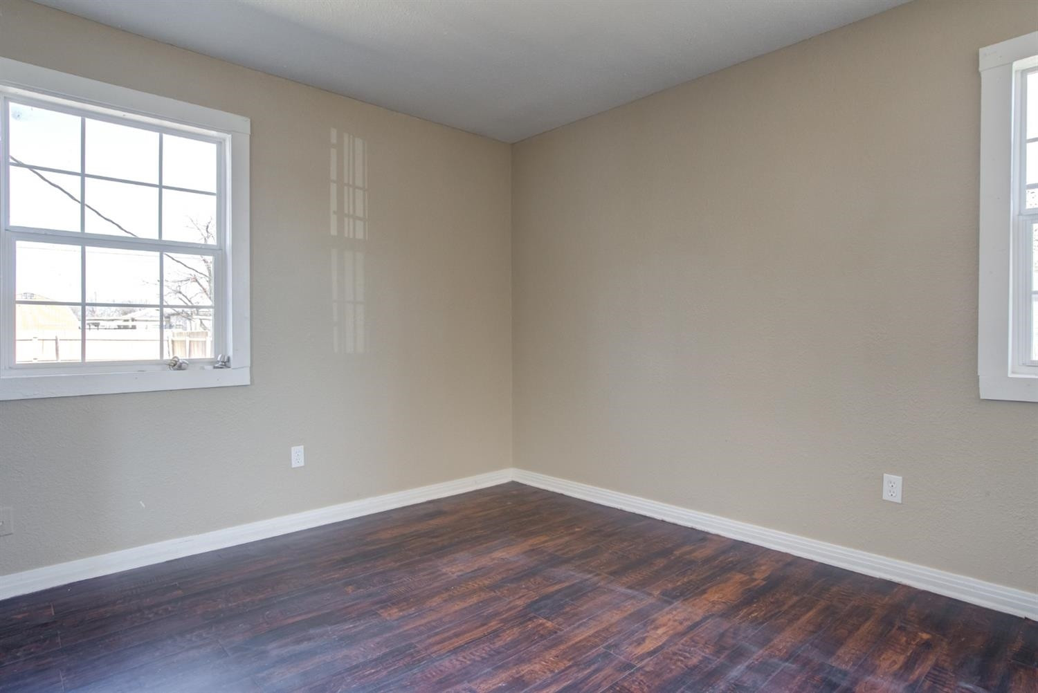 526 53rd Street Lubbock, TX 79404 - Photo 11 of 28 wooden floor in an empty room with a window