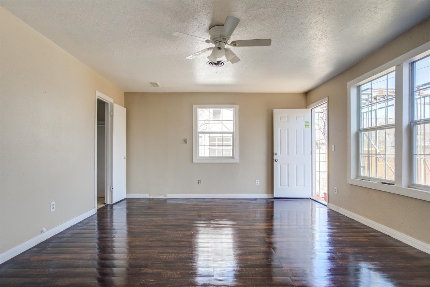 526 53rd Street Lubbock, TX 79404 - Photo 17 of 28 an empty room with wooden floor and windows