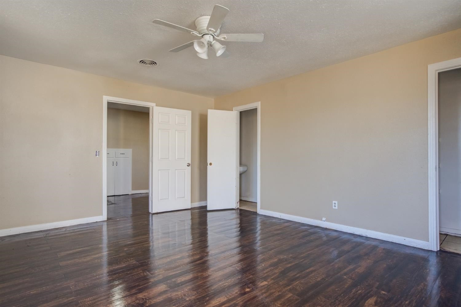 526 53rd Street Lubbock, TX 79404 - Photo 19 of 28 a view of an empty room with wooden floor