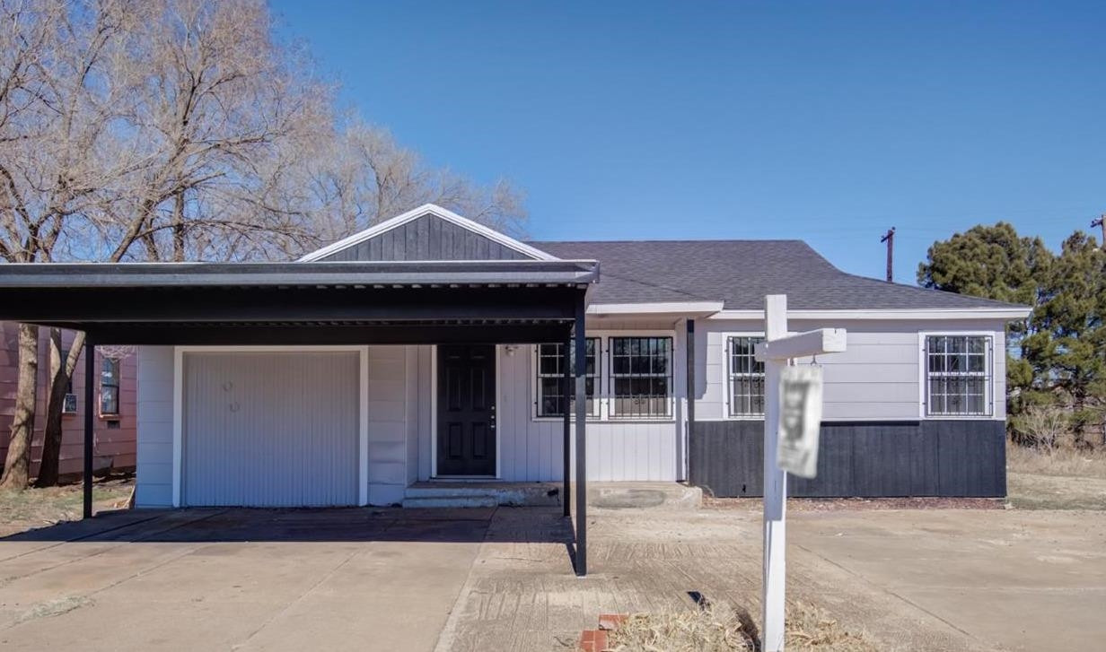526 53rd Street Lubbock, TX 79404 - Photo 2 of 28 a front view of a house with a garage