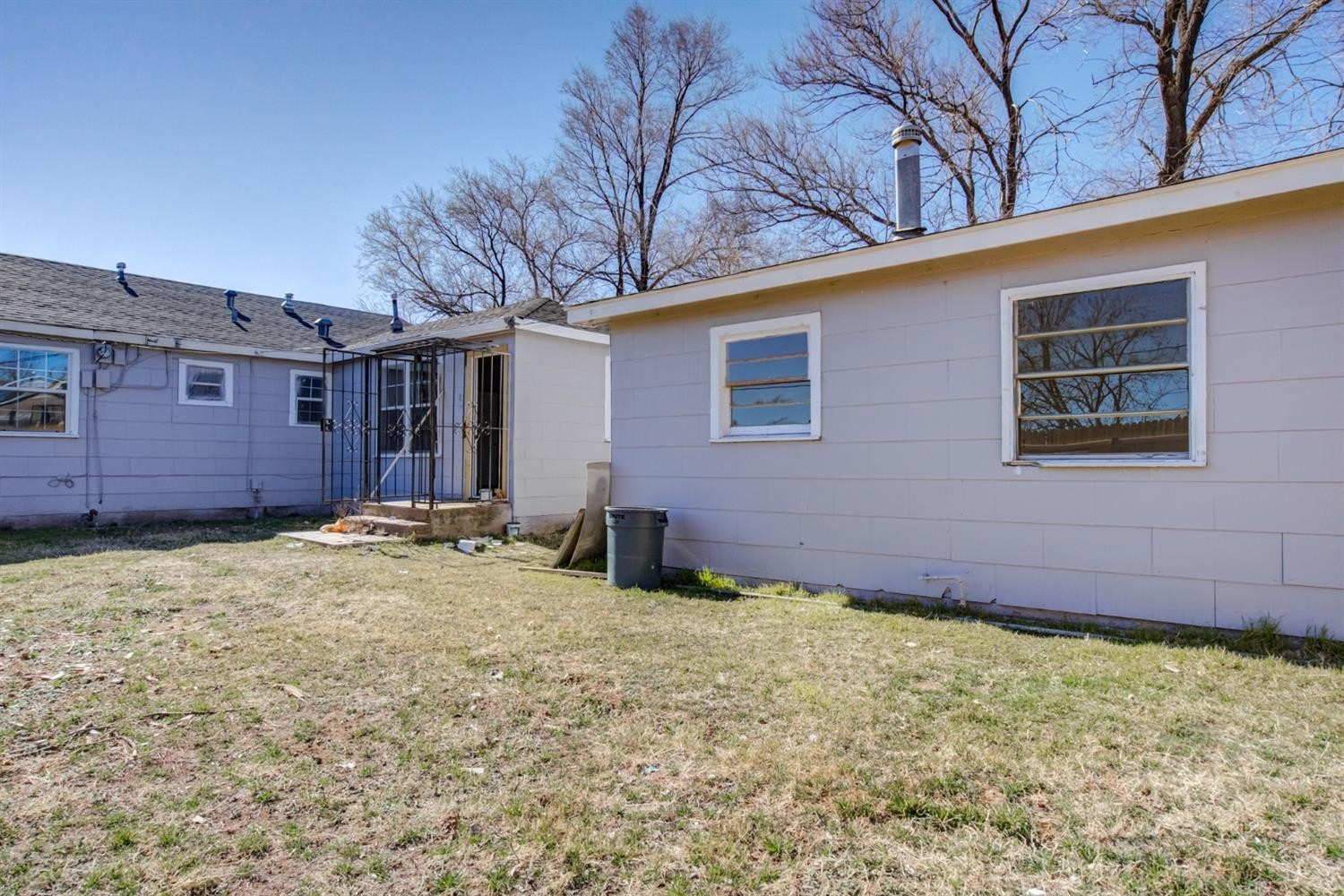 526 53rd Street Lubbock, TX 79404 - Photo 22 of 28 a view of a backyard with a large tree