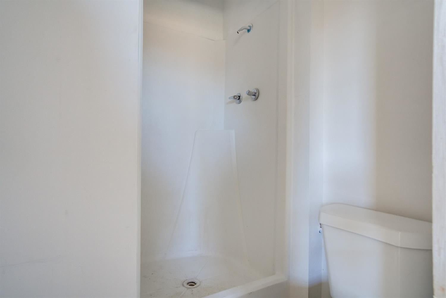 526 53rd Street Lubbock, TX 79404 - Photo 25 of 28 a bathroom with a toilet and a shower
