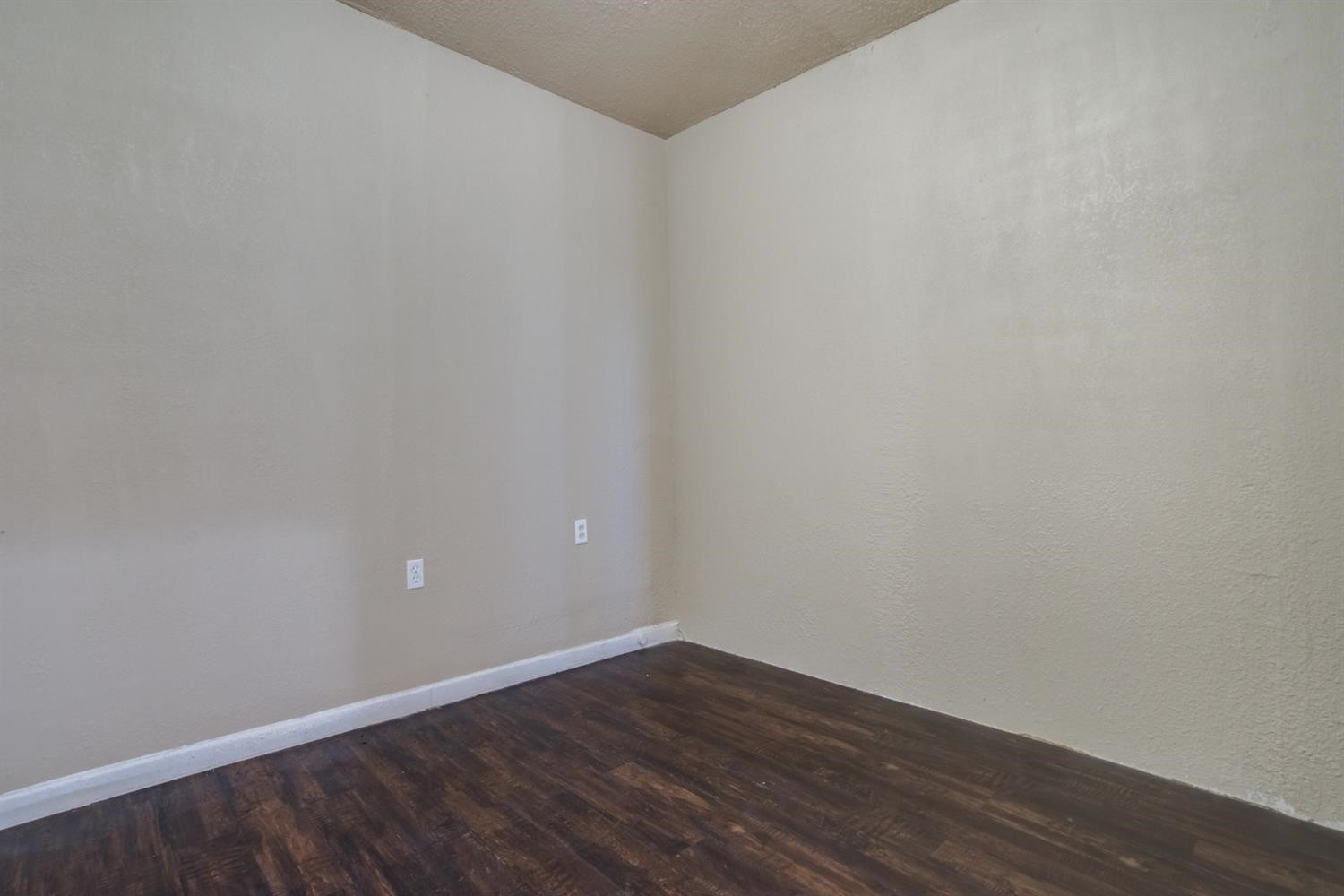 526 53rd Street Lubbock, TX 79404 - Photo 6 of 28 a view of an empty room with wooden floor
