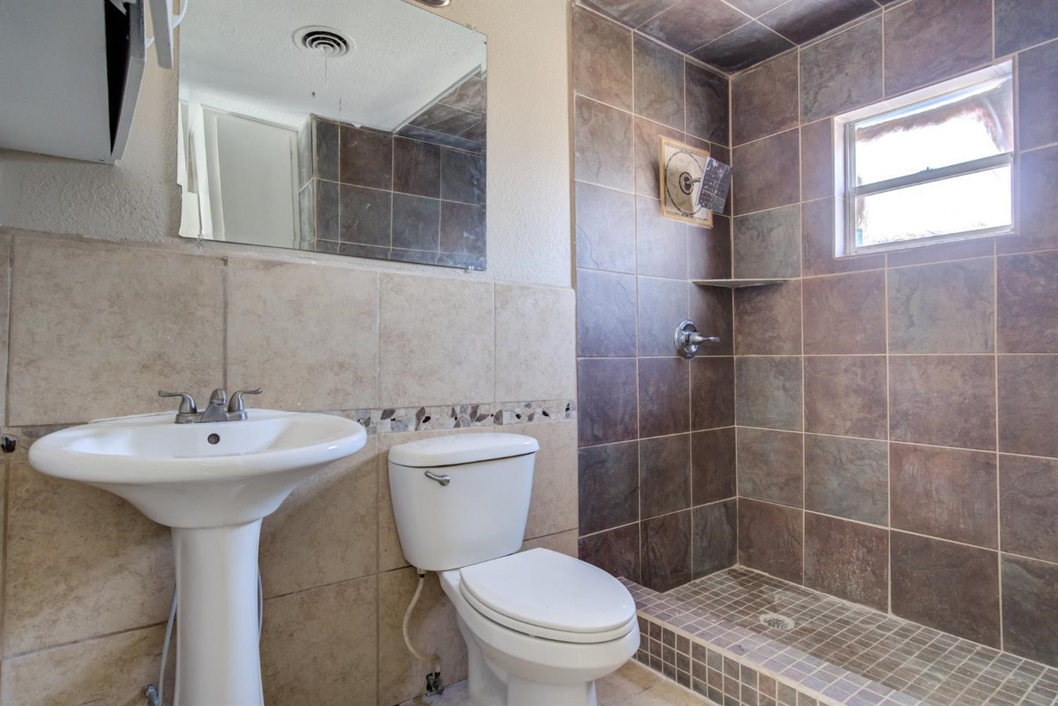 526 53rd Street Lubbock, TX 79404 - Photo 10 of 28 a bathroom with a sink toilet and shower