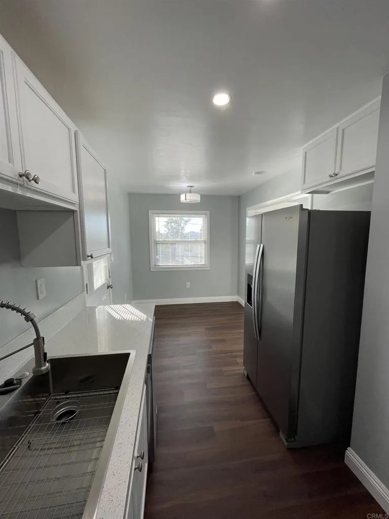 1419 Flo Drive Alpine, CA 91901 - Photo 11 of 27 a kitchen with kitchen island a counter top space a sink stainless steel appliances and cabinets