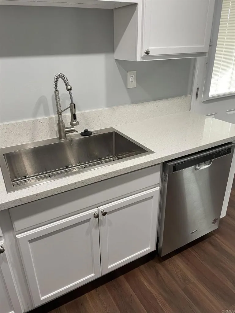 1419 Flo Drive Alpine, CA 91901 - Photo 10 of 27 a close view of sink and cabinets with wooden floor
