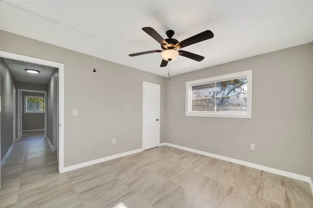 a view of a big room with wooden floor and closet