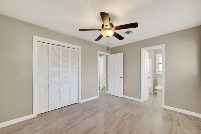 a view of an empty room and wooden floor