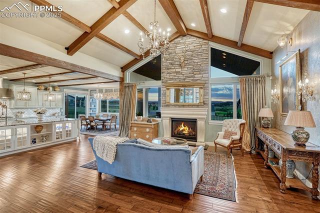 1935 Bashley Road Monument, CO 80132 - Photo 45 of 45 Manor meets modern in this spacious open concept living, dining and kitchen floor plan. Thoughtful design and use of complementary materials brings the rooms together in the most tasteful way.