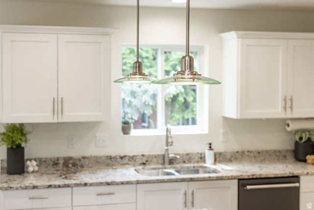 1552 Sumac Drive Logan, UT 84321 - Photo 14 of 72 Kitchen featuring white shaker cabinetry, granite countertops, dual basin stainless steel sink with a gooseneck faucet, and two glass pendant lights