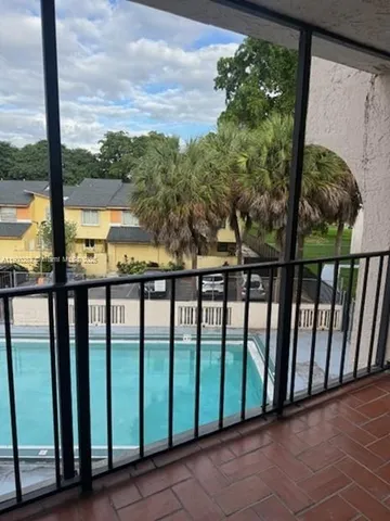 a view of a street from a balcony