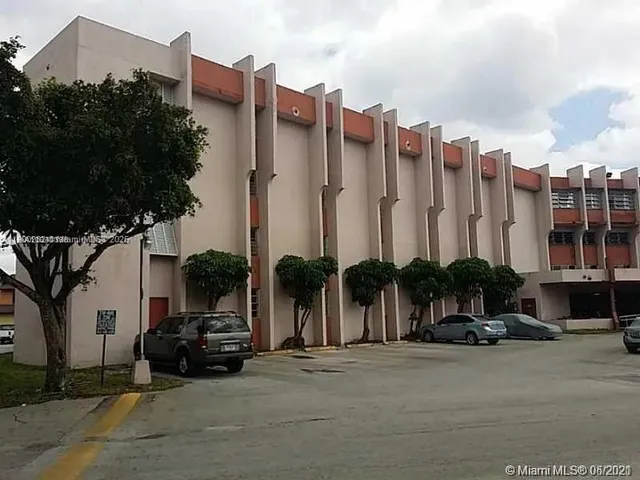 a view of a city street lined with tall buildings