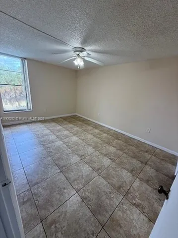 a bathroom with a granite countertop toilet a sink and bathtub