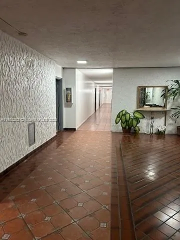 a view of a living room and a livingroom with furniture