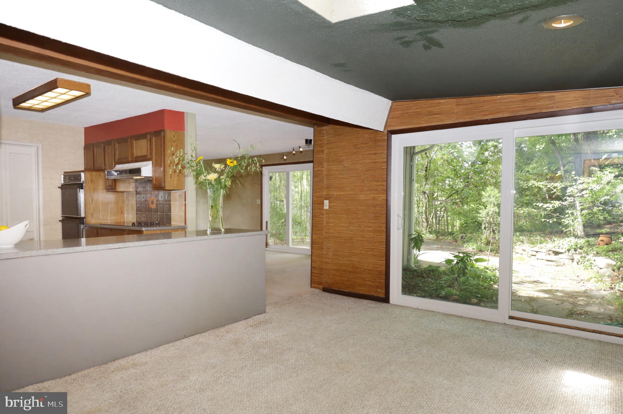 7817 Fort Hunt Road Alexandria, VA 22308 - Photo 17 of 51 Family Room w/ Skylight & Slider to Backyard Patio