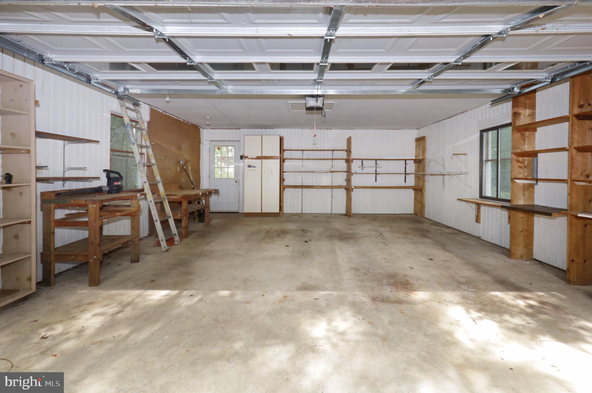 7817 Fort Hunt Road Alexandria, VA 22308 - Photo 38 of 51 Garage with Shelves & Work Bench