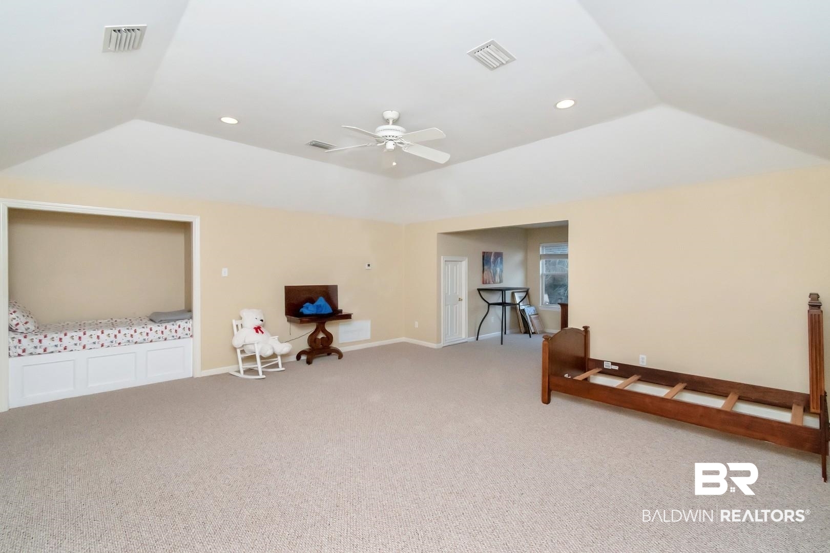 1050 Southern Way Court Mobile, AL 36609 - Photo 25 of 36 Additional living space with vaulted ceiling, carpet floors, and ceiling fan