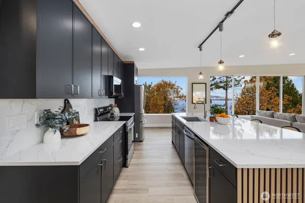 a kitchen with lots of counter space and window