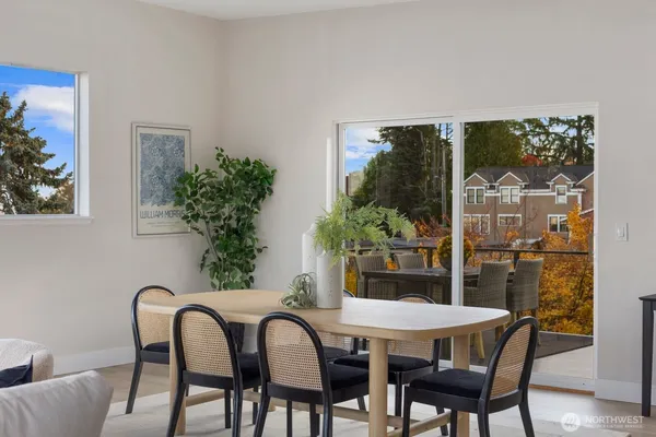 a dining room with furniture and wooden floor