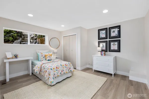 a bedroom with bed and a window