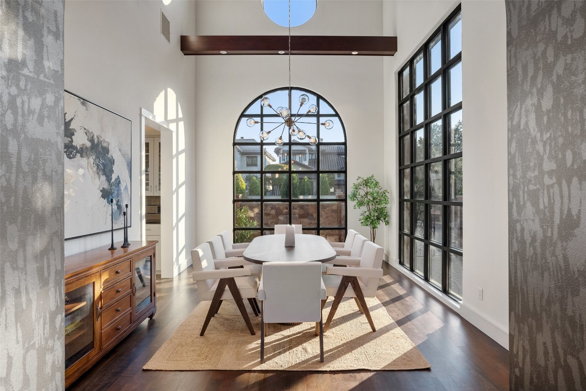 7025 Cielo Azul Pass Austin, TX 78732 - Photo 12 of 35 a view of a dining room with furniture window and wooden floor
