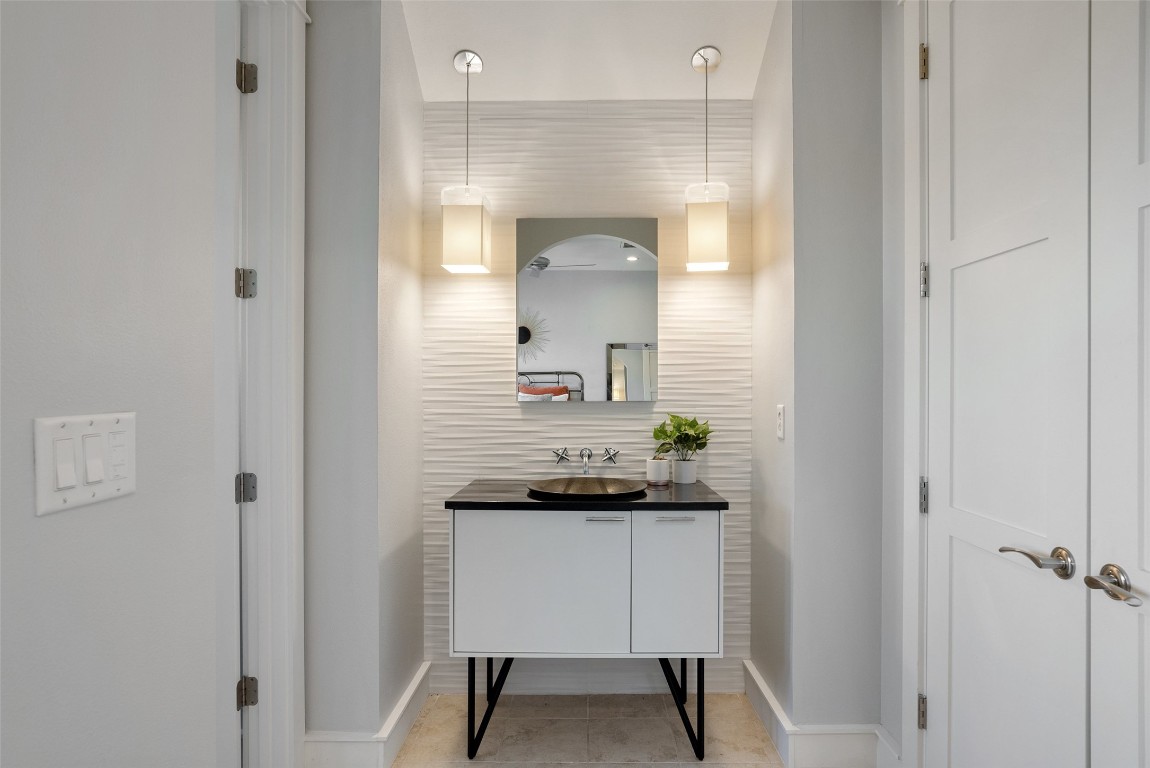 7025 Cielo Azul Pass Austin, TX 78732 - Photo 19 of 35 a bathroom with a sink and a mirror