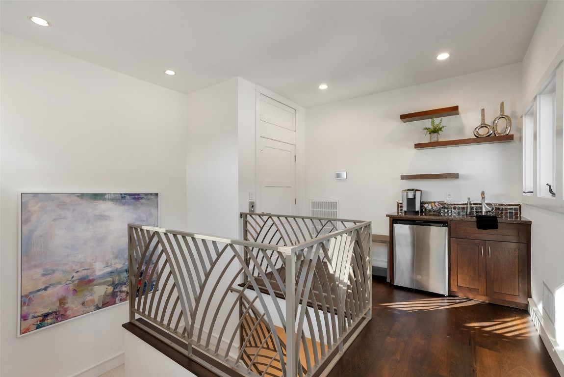 7025 Cielo Azul Pass Austin, TX 78732 - Photo 22 of 35 a kitchen with stainless steel appliances granite countertop a stove and a sink