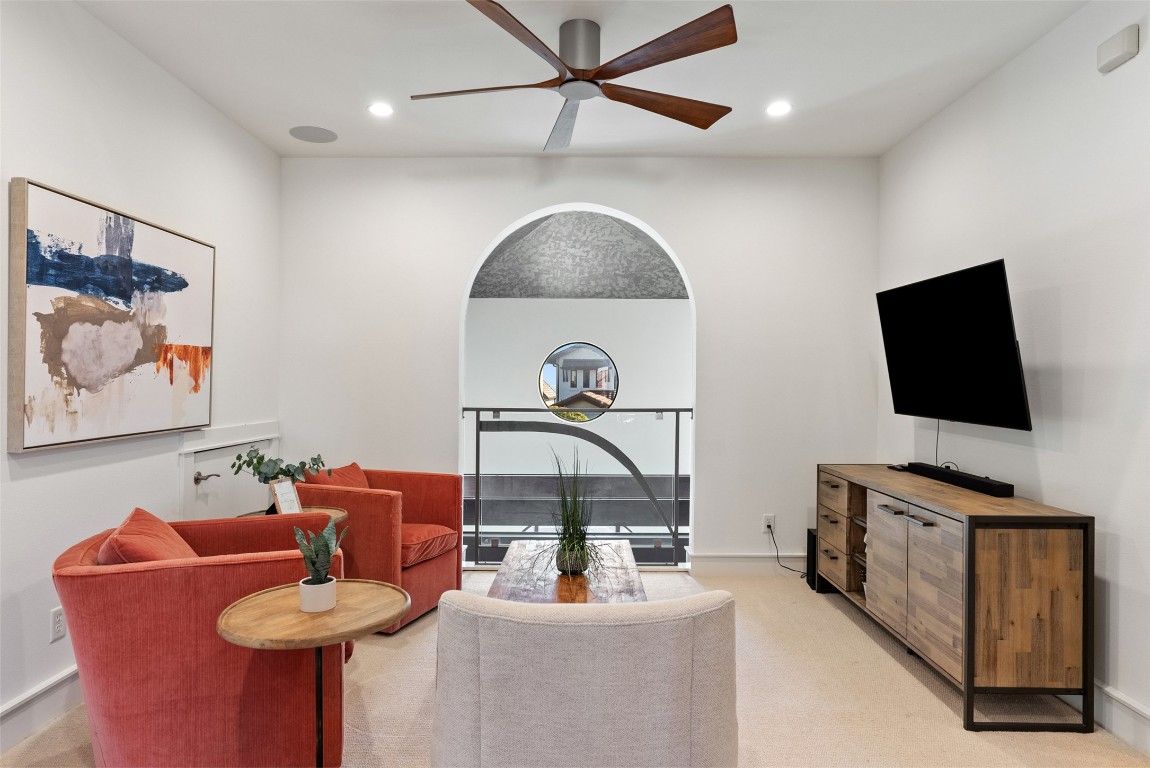7025 Cielo Azul Pass Austin, TX 78732 - Photo 25 of 35 a living room with furniture and a flat screen tv