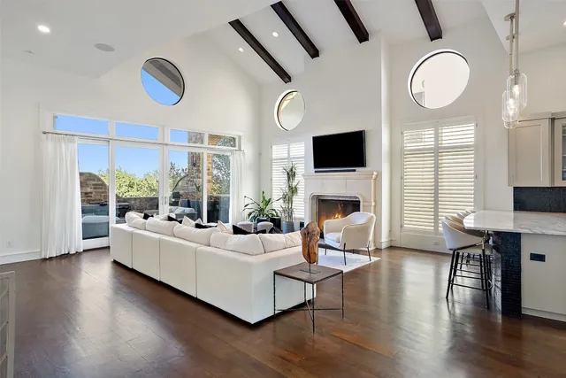 a living room with fireplace furniture and a flat screen tv