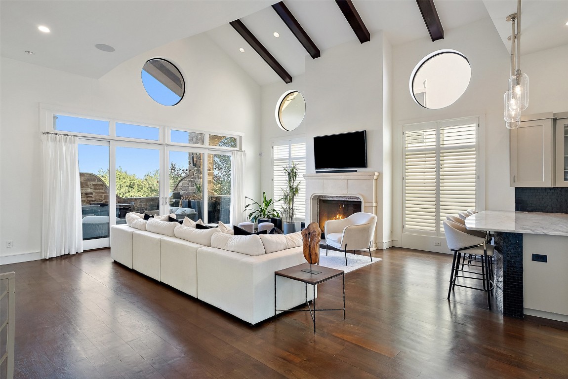 7025 Cielo Azul Pass Austin, TX 78732 - Photo 6 of 35 a living room with fireplace furniture and a flat screen tv