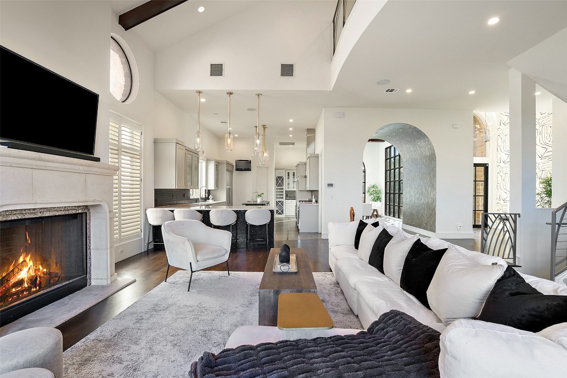 7025 Cielo Azul Pass Austin, TX 78732 - Photo 7 of 35 a living room with furniture fireplace and flat screen tv