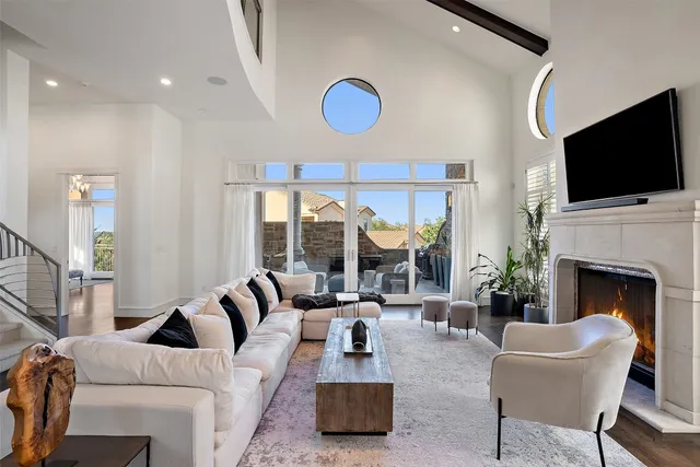 a living room with furniture fireplace and flat screen tv