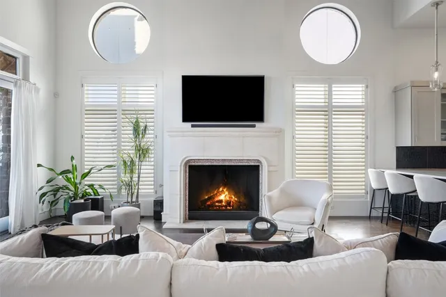 a living room with furniture fireplace and a flat screen tv