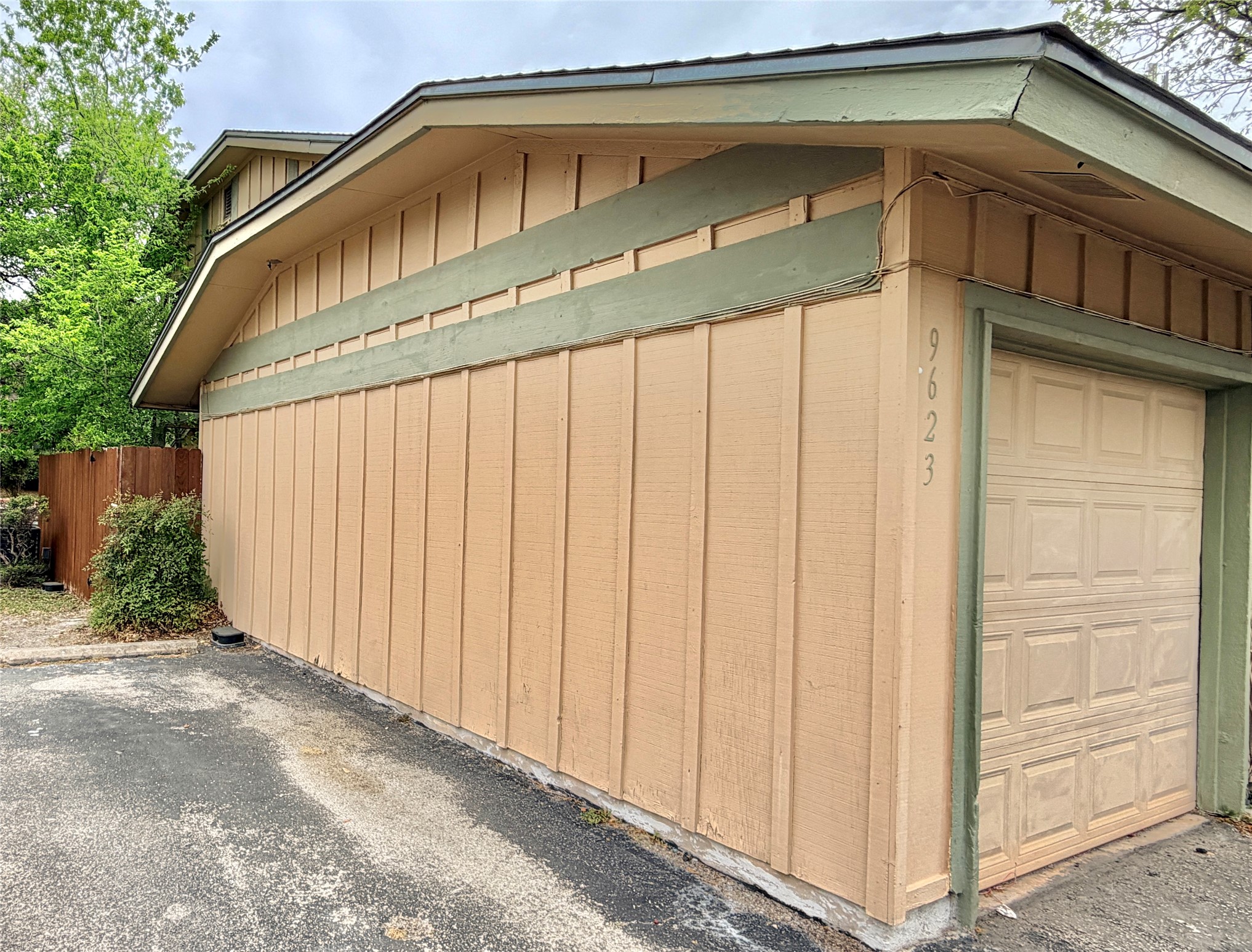 9623 Covey Ridge Lane Austin, TX 78758 - Photo 2 of 40 View of side of home featuring a garage