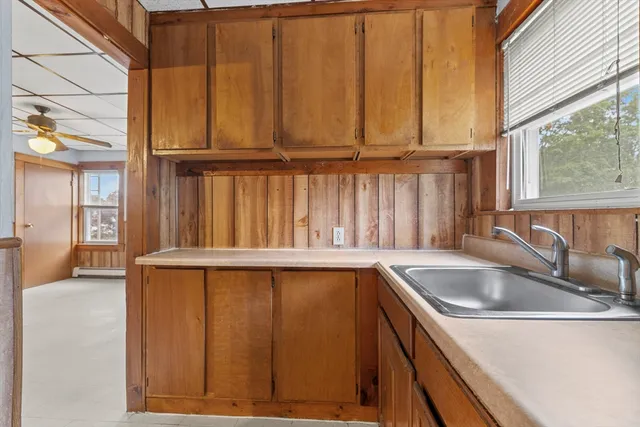 a kitchen with a sink and cabinets