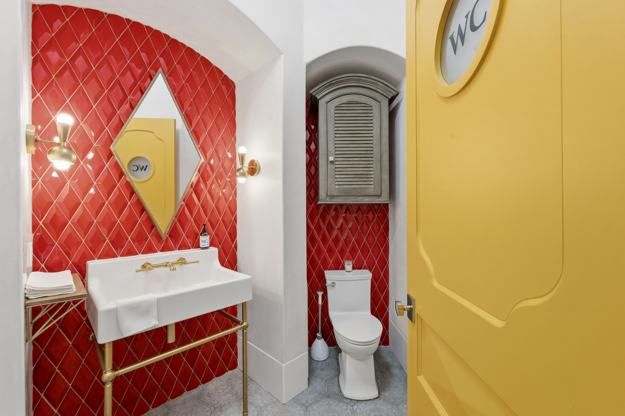 27006 Star Gazer Way Spring, TX 77386 - Photo 6 of 50 Powder Bath- This beautifully appointed powder room features a brass-leg sink, custom brass lighting, and exquisite handmade Ken Mason wall tile.